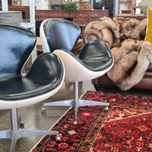 Mid Century Leather and Hide Swivel Egg Chairs