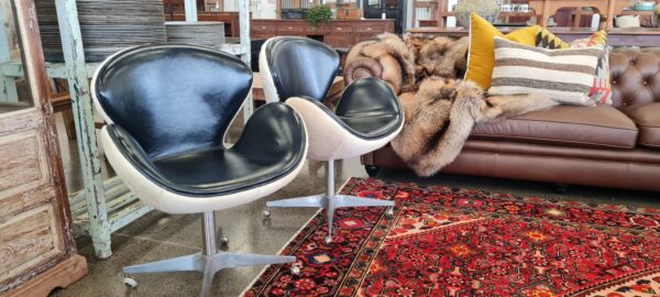 Mid Century Leather and Hide Swivel Egg Chairs